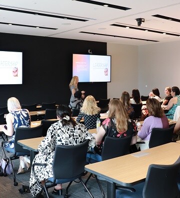 executive women listening to presentation
