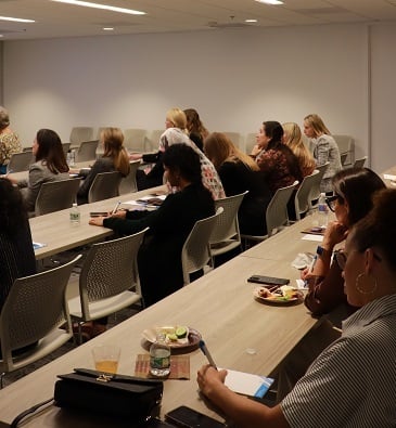 attendees writing down their thoughts