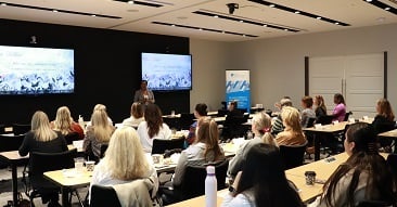 women listening to the presentation