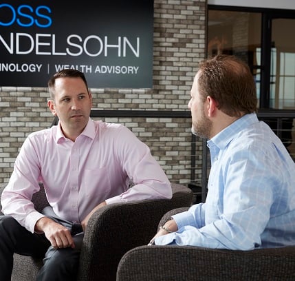 two gross mendelsohn employees talking