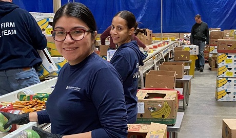 Jocelyn Diaz and Rachel Santos volunteering at Maryland Food Bank