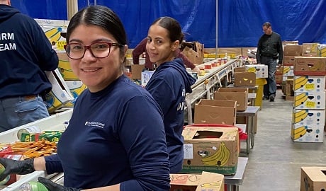 Jocelyn Diaz and Rachel Santos volunteering at Maryland Food Bank