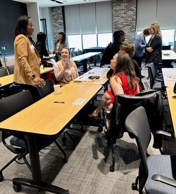 women chatting after presentation