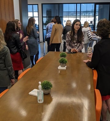 women gathered in office kitchen