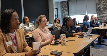 women listening to presentation