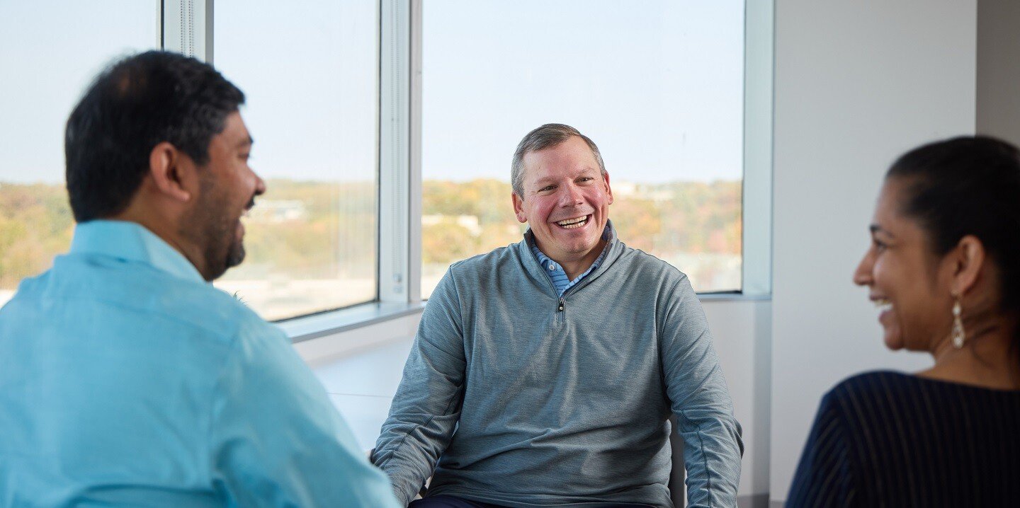 co-workers laughing together